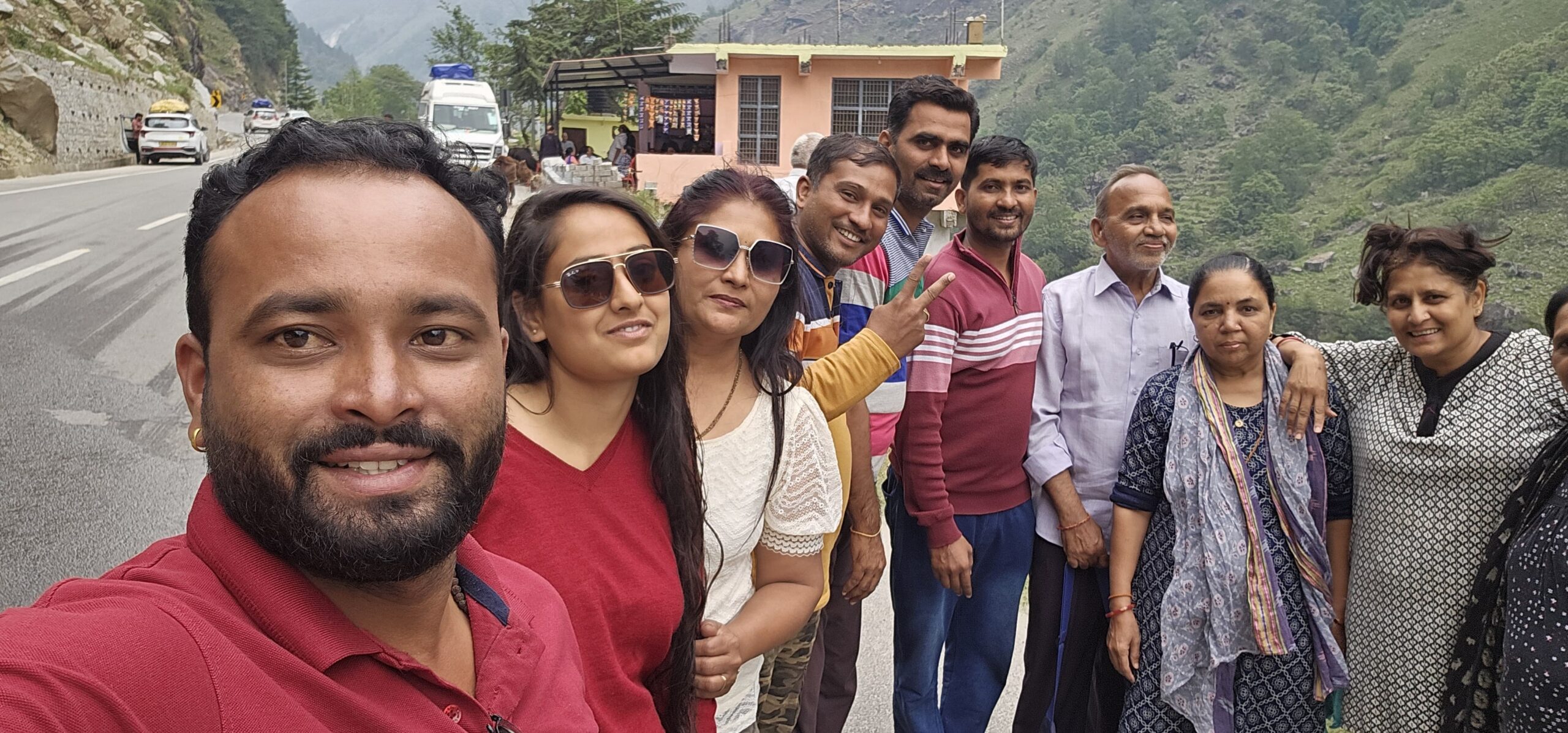 Group of travelers enjoying a scenic Himalayan viewpoint during their Uttarakhand trip