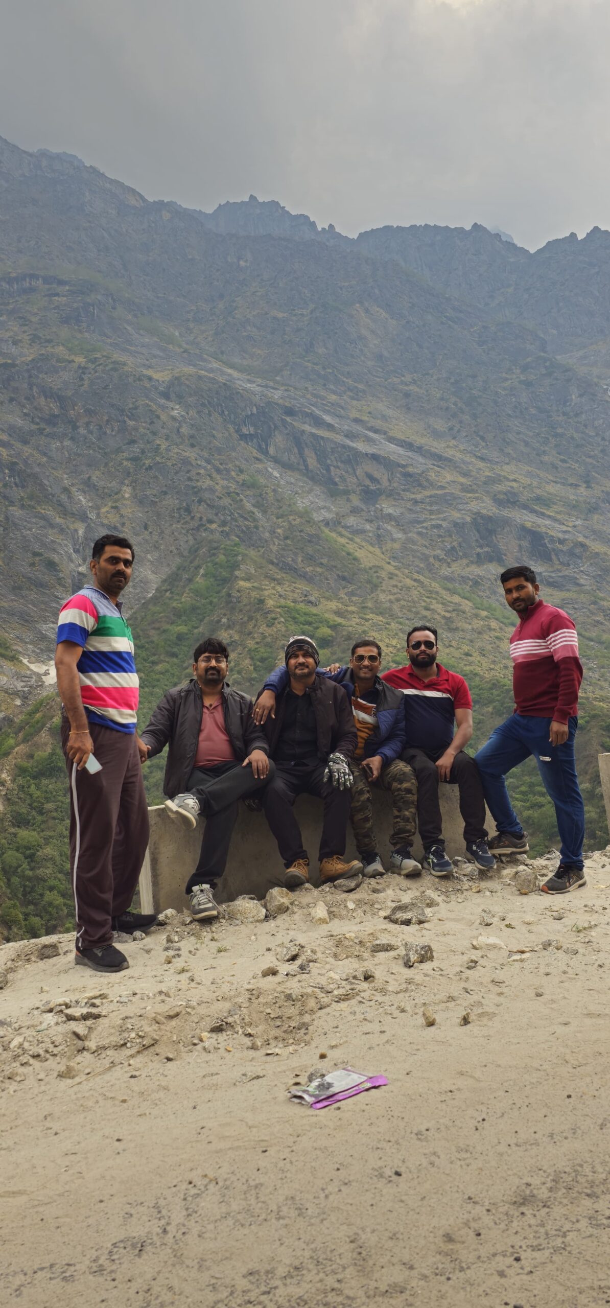 Group of travelers enjoying a scenic Himalayan viewpoint during their Uttarakhand trip
